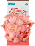 Organic Non-GMO pink mushrooms growing from a 10-day indoor grow kit box labeled Back to the Roots